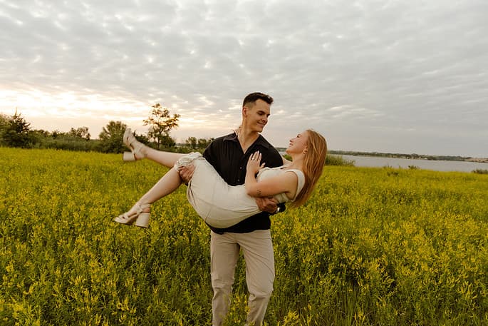 Micah carrying Abigail in the field